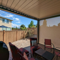 Cozy patio seating area under covered roof
