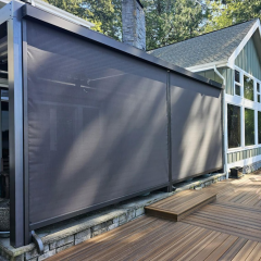 Outdoor patio with wooden decking and screens